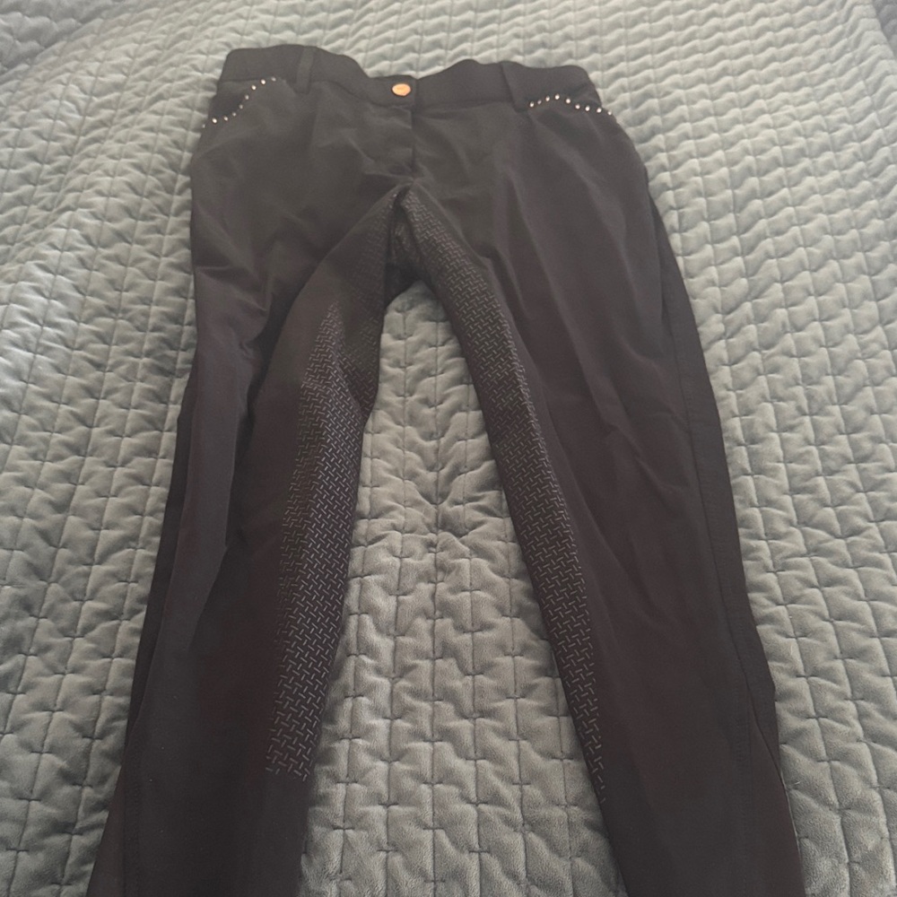 Black HKM breeches with rose gold accents.